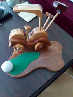Handmade golf cart on wood very detailed and in new condition. Great for the golfers desk