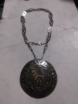 925 Silver and gold pendant slash broach with with silver chain chain lent 25-in used