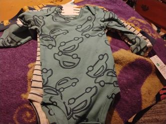 Brand new never used still with tags 6 months boy clothing.   Set of 4 onesies