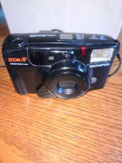 Olympus Infinity Zoom 210 with variable power flash.