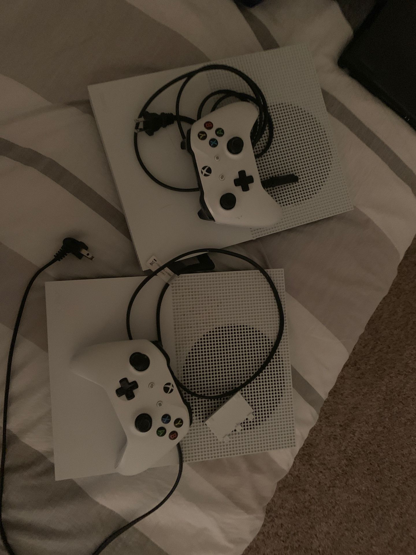 2 xbox one s with 2 controllers.