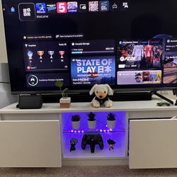 55” inch TCL Tv and White Tv table with LED Lights for sale