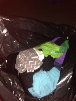 Girls clothes n boy newborn n a bag of diapers