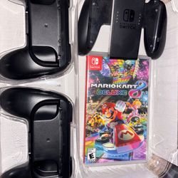 2 games and 2 joy con grips and one Nintendo switch controller
