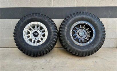 Huge sale. On 15x7 4x136 4x137 Beadlock wheels & 30x10-15 tires for CAN AM HONDA UTV SXS (We Finance..