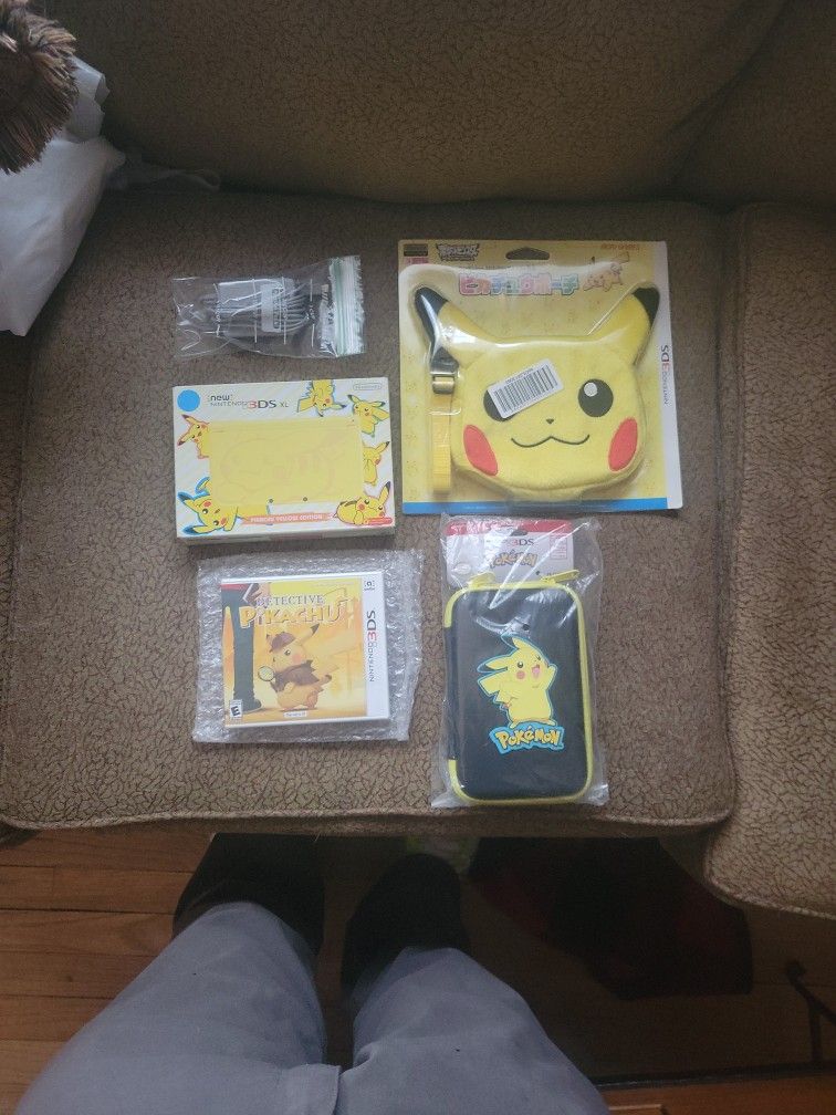 Nintendo 3DS XL Pikachu Yellow Edition Pack W/ Detective Pikachu Game, Charger, Pikachu Hard Pouch, And Japanese Import Mori Plush Pikachu Head Bag