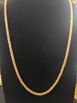 $12. Vintage TRIFARI gold plate necklace with white interwoven chain. 30 inches.