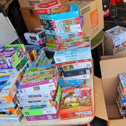 Boxes full of NICE 300 and 500 pc. Puzzles $5. each