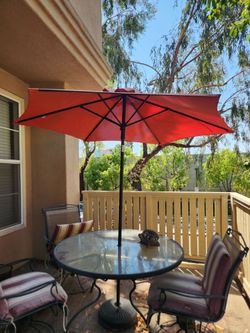 Outside table with umbrella