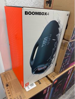 New JBL Boombox 4 portable speaker in original box. This blue speaker has IP67 waterproof and dustproof rating. It features up to 24 hours of playtime