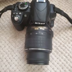 Nikon D 3100 With Extended Lens And Nikon Strap