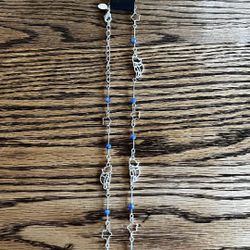 Silver beaded necklace with Disney’s Winnie the Pooh and blue beading