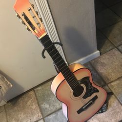 Guitar With Strap And Metal Stand