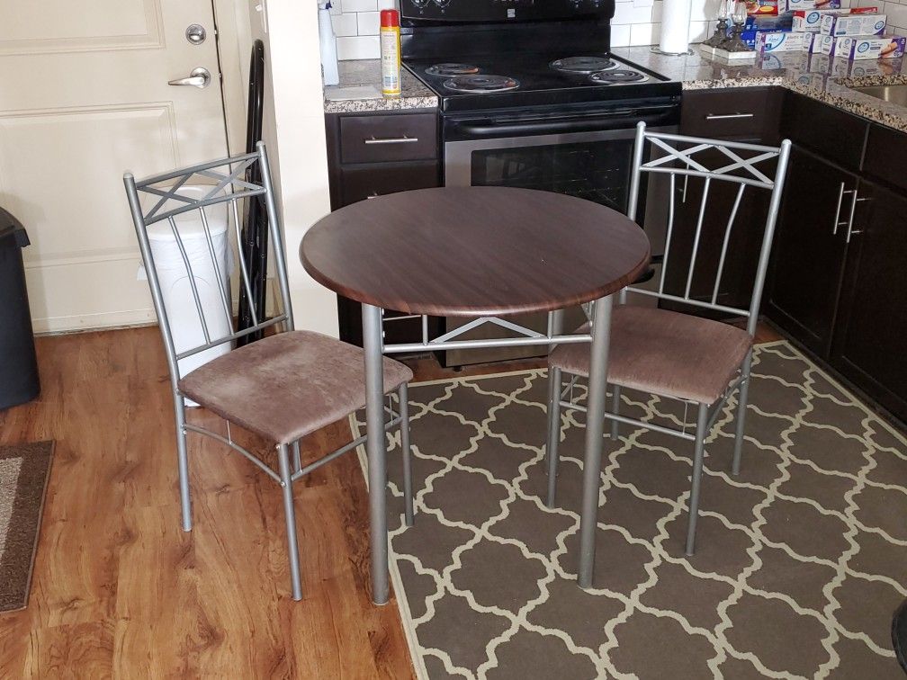 Breakfast Table and two Chairs