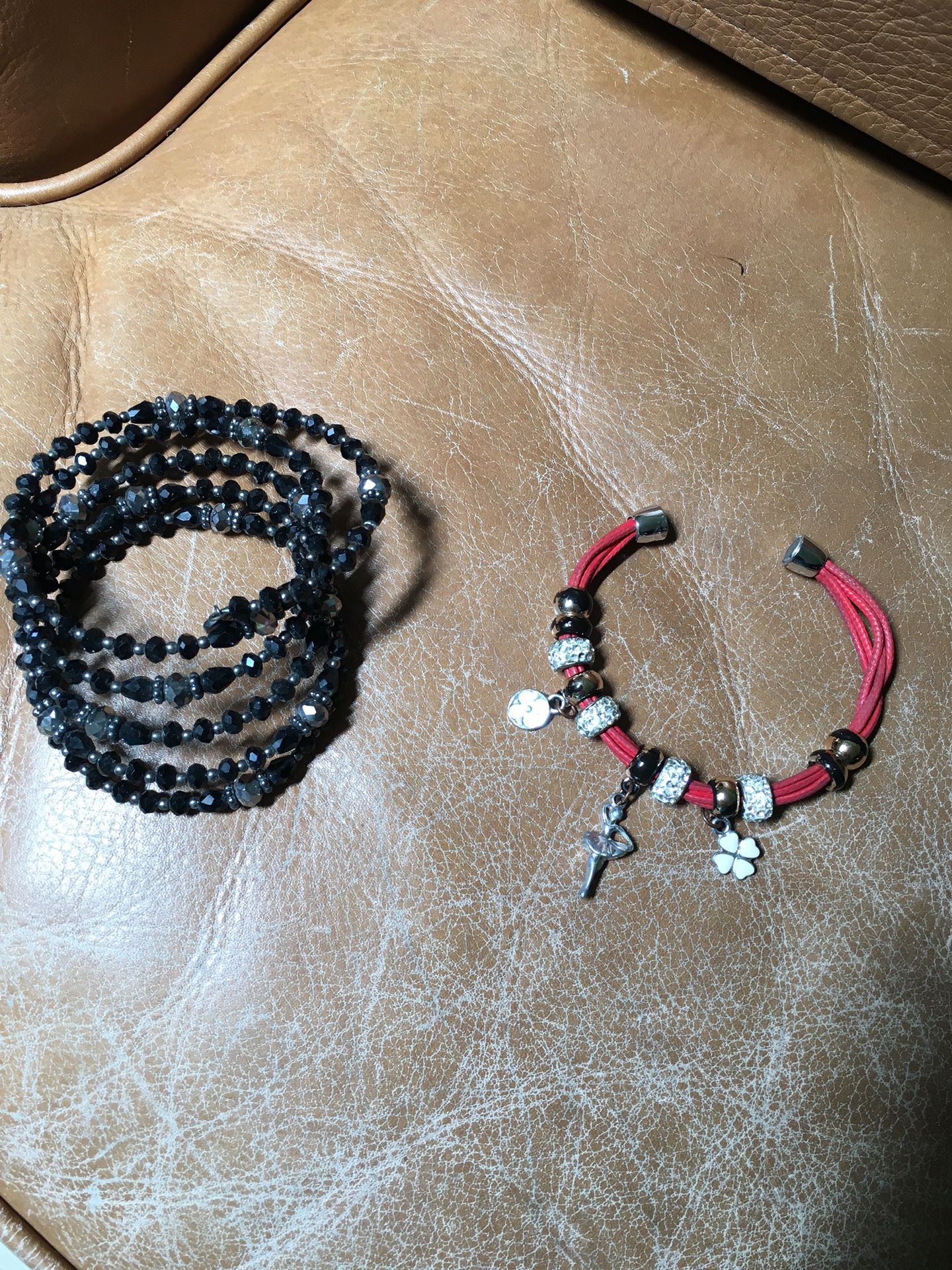 Black crystal slip on bracelet/red rope magnet bracelet with charms $3 each