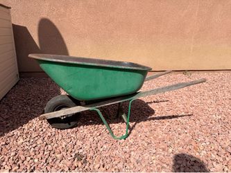 Broken Wheel Barrel For Flowers