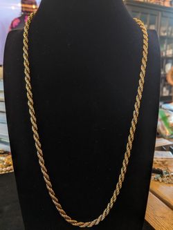 $12. Gold plated rope chain necklace with black chain and roving. 24 inches.