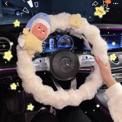 The steering wheel cover is cute and fluffy.