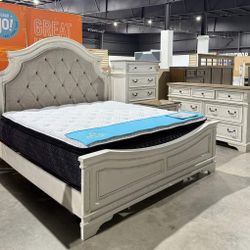 Realyn Chipped White Upholstered Panel Bedroom Set. Bed, Dresser, Mirror, Nightstand, Chest 