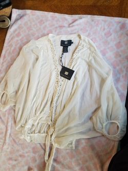 Light short cardigan. New with tag. Size XL