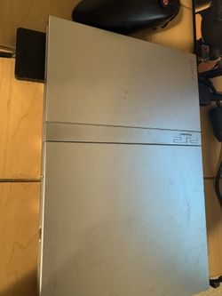 Working Silver PlayStation Slim 