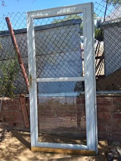 Glass storm screen door