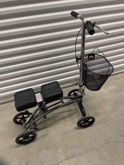 Duel pad steerable knee walker w/ basket