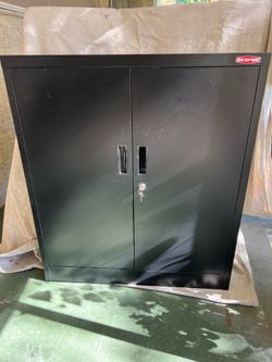 Black metal cabinet storage. 2 movable shelves.