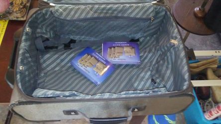 Traveling suitcase with lock & keys and wheels.