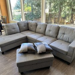 Gray Linen Sectional Couch And Storage Ottoman
