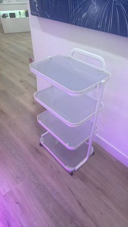 Stylish and sturdy 4-tier rolling utility cart featuring frosted glass shelves