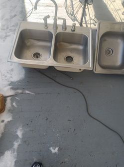 Two Double Stainless Steel Sinks With Faucets