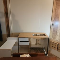 Horn Sewing Cabinet Has A Table Attached 
