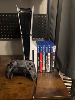 PS5 + controller + 7 games