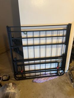 Twin mattress and folded up frame