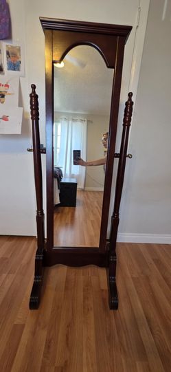 Wood jewlry armoire.