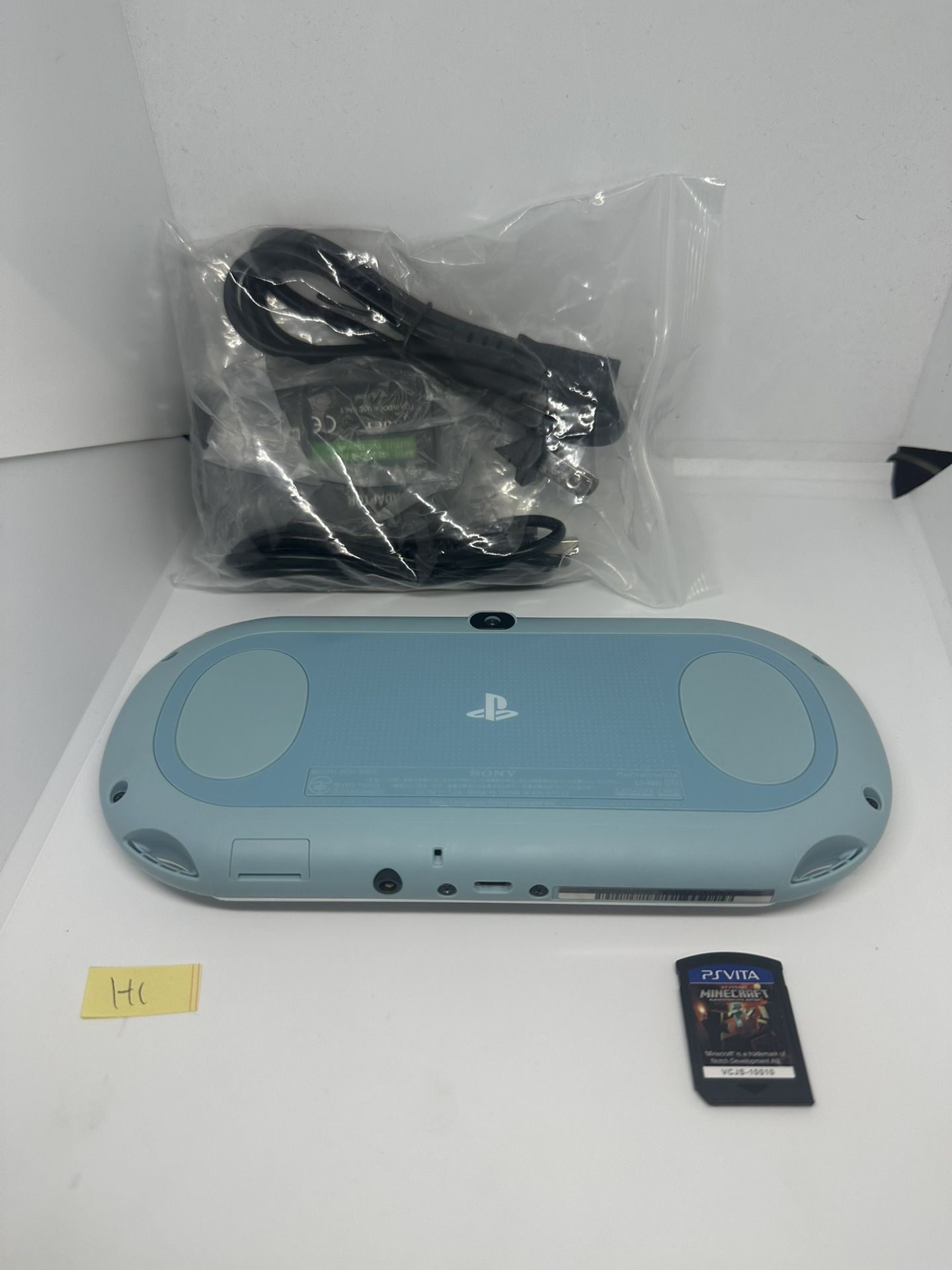 Ps vita 2000 light blue w/game & charger