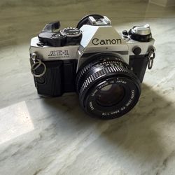 Canon AE-1 Program 35mm Manual SLR Film Camera with 50mm 1:1.8 