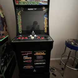 1 Up Arcade. Asteroids and centipede a bunch of games on this console.