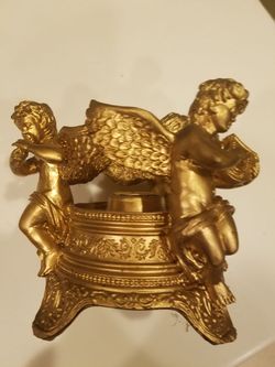 Large gold cherub candle holder