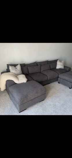Dark gray sectional with ottoman