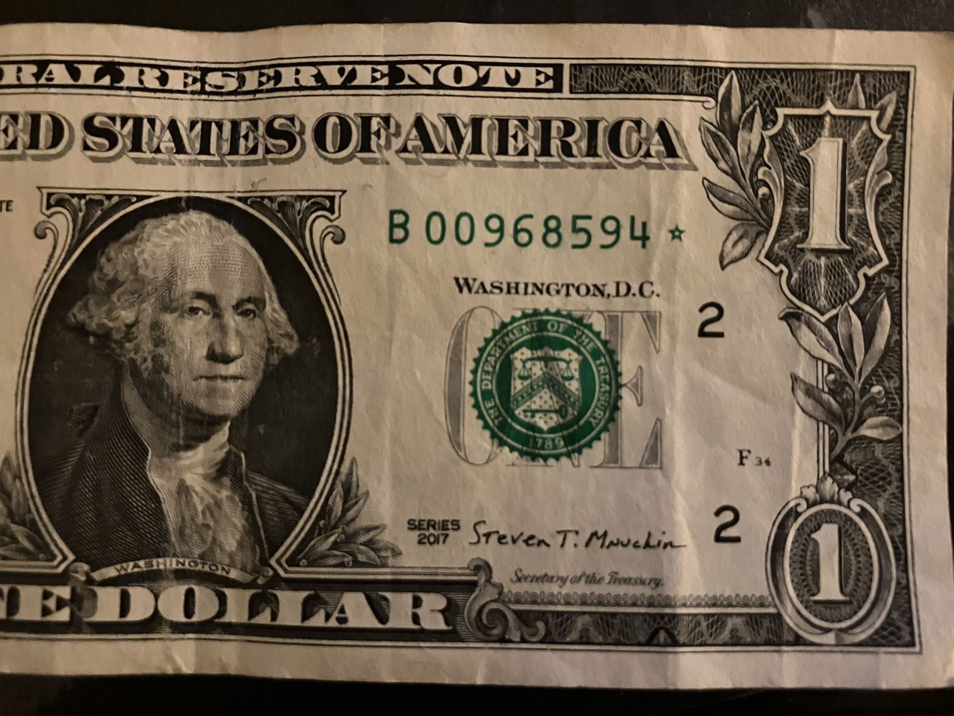 One dollar W/star & low serial number/00968594
