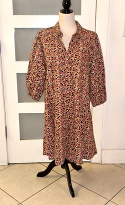 Floral print shirt dress from Zara. Features a flowing design, polo collar with a V-neck, and three-quarter length puff sleeves with elasticated cuffs