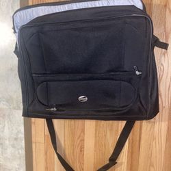 black American Tourister garment bag