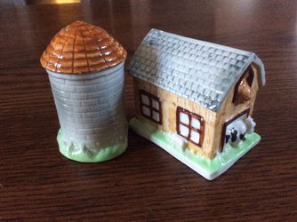 Never used country barn and silo salt and pepper shakers.