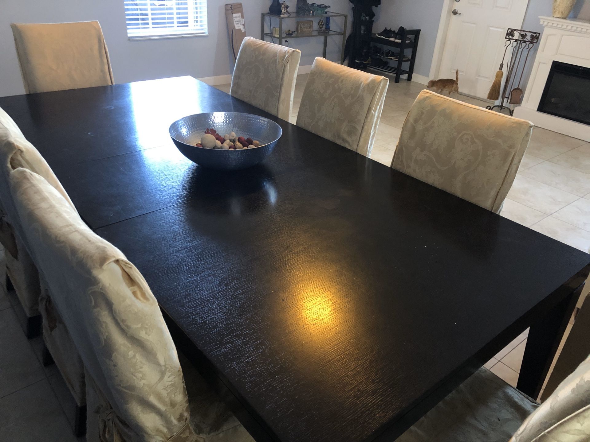 Dark brown table with 8 chairs