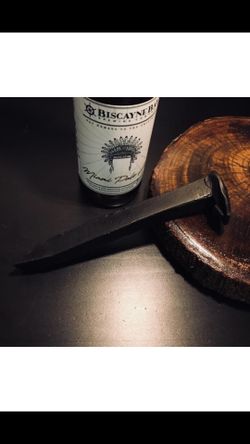 Railroad spike bottle opener