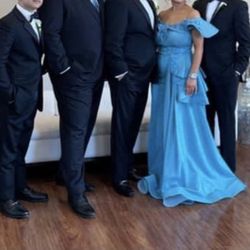 Elegant Turquoise party dress with removable skirt, size 42  M-L   Worn once in good condition  Asking $250      Sterling Heights.. Size M
