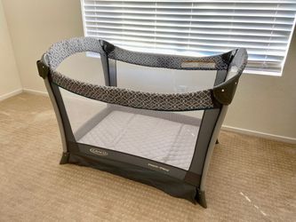 New Graco pack and play portable compact baby play yard and changer in a grey color.