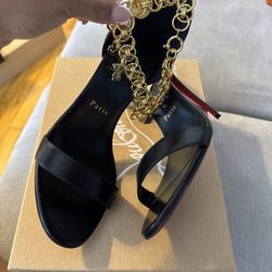 CHRISTIAN LOUB WITH GOLD CHAIN 